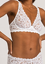 Front view of a women model wearing Hanro white microfibre Soft Cup Bra