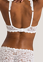 Back view of a women model wearing Hanro white microfibre Soft Cup Bra