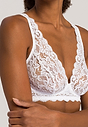 Close-up view of a women model wearing Hanro white microfibre Soft Cup Bra