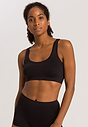 Front view of a women model wearing Hanro black microfibre Crop Top