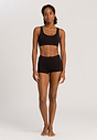 Full-body view of a women model wearing Hanro black microfibre Crop Top