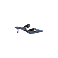 The Gilliane Denim Mule in blue features a pointed toe, two straps embellished with embossed dome buttons, and a sleek, minimalist design displayed on a white background.