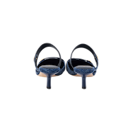 Rear view of the Gilliane Denim Mule, a pair of blue denim heeled sandals featuring ankle straps and memory foam cushioning, displayed against a plain white background.