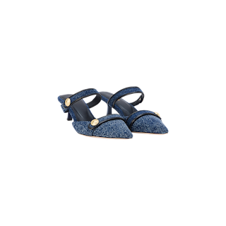 Introducing the Gilliane Denim Mule: a pair of blue pointed-toe heeled mules crafted from denim, featuring double straps accented with embossed dome buttons for an elegant finish, and designed with a supportive memory foam cushion—all showcased on a white background.