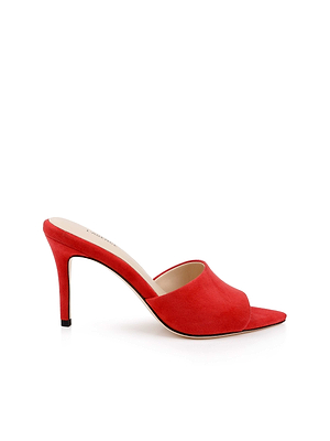 The Lolita Suede Open-Toe Mule, crafted from soft red suede with a stiletto heel, is displayed on a white background.