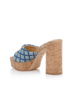 The Gabriell Platform Sandal is a high-heeled mule with a cork block heel and platform, blue and white checkered fabric upper, and memory foam cushion. Shown angled from the back and side against a white background.