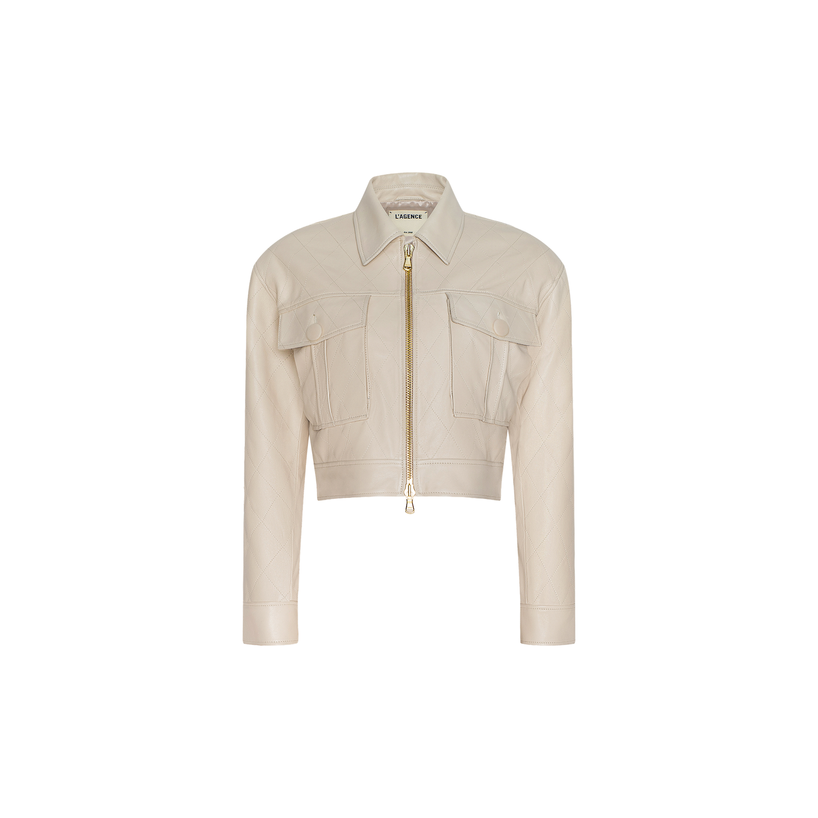 The Micah Oversized Leather Jacket features a cropped silhouette in light beige leather, with a gold zipper, two front flap pockets, long sleeves, and a shirt-style collar. The background is plain white.