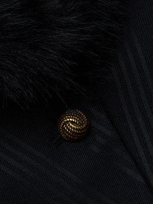 Close-up of the Kaisley Faux Fur Collar Blazer by L'AGENCE, featuring dark pinstriped twill, a gold braided button, and a black faux fur collar for a luxurious look.
