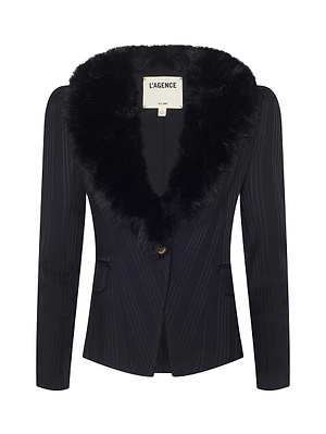 The Kaisley Faux Fur Collar Blazer by L'AGENCE is a black twill suiting blazer with a wide faux fur collar, fitted silhouette, long sleeves, single front button, two flap pockets, and an inner L'AGENCE label.