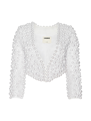 The Belle Oversized Pearl Jacket by L’AGENCE is a white, cropped, open-front jacket with long sleeves, adorned with hand-sewn faux pearls in varying sizes—a statement piece that transforms any look.