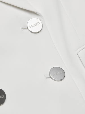 Buttons accent the Aven Wrap Blazer, a white wrap-front design crafted from modern suiting fabric.