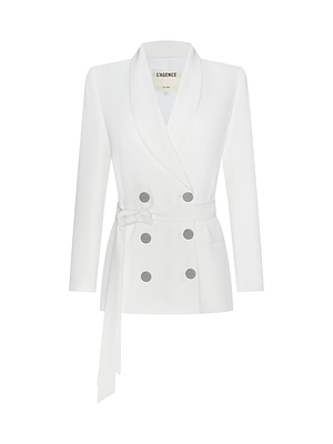 The Aven Wrap Blazer is a white, double-breasted women’s blazer in modern suiting fabric with long sleeves, a shawl collar, grey buttons, and a matching belt at the waist.