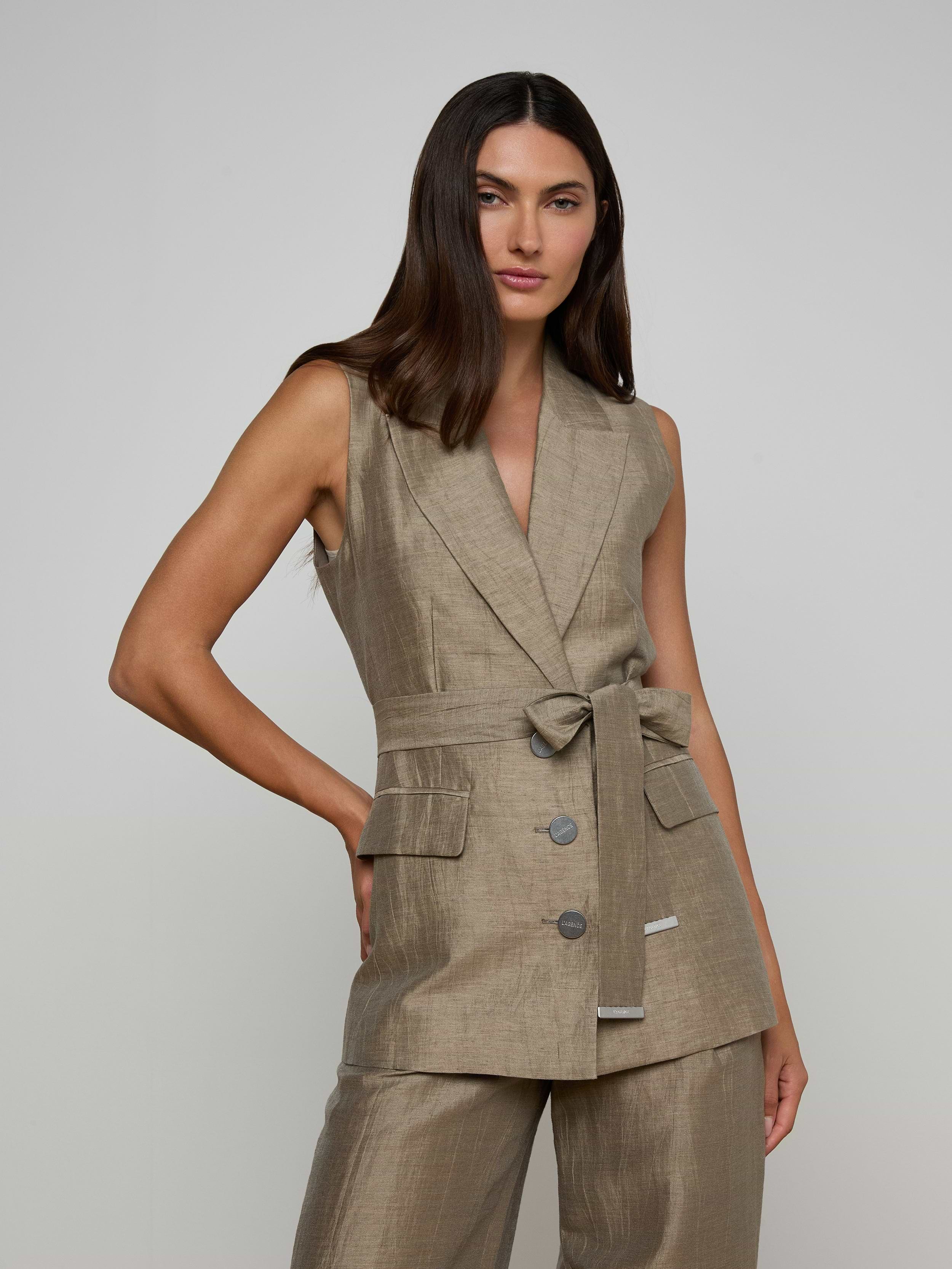 A woman with long dark hair wears the Harper Linen-Blend Vest with matching pants, standing against a plain light background.