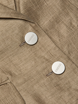 Close-up of the Harper Linen-Blend Vest in light brown, featuring two round white HABENCE-engraved buttons and visible stitching. Pair it with matching pants for a polished, coordinated look.
