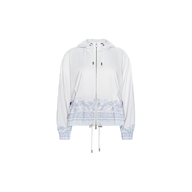 The Miro Hooded Windbreaker features a white design accented with light blue decorative patterns along the hem and cuffs. It offers a front zipper closure, adjustable drawstrings at the hood and hem, and button details on the sleeves. Made from water-repellant fabric, it provides protection in light rain.