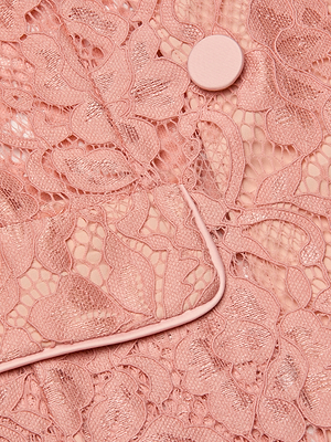 Close-up of the Jordana Lace Blazer featuring sheer pink floral lace, a matching pink button, and piped seam details. The intricate design overlays nude fabric, making it perfect for Spring 2026.