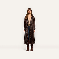 A person wearing an oversized, dark brown nylon Brinley Nylon Trench Coat over a tan top, jeans, and brown suede knee-high boots.