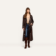 A person wearing a dark-brown Brinley Nylon Trench Coat over a beige bodysuit, blue jeans, and brown knee-high boots.