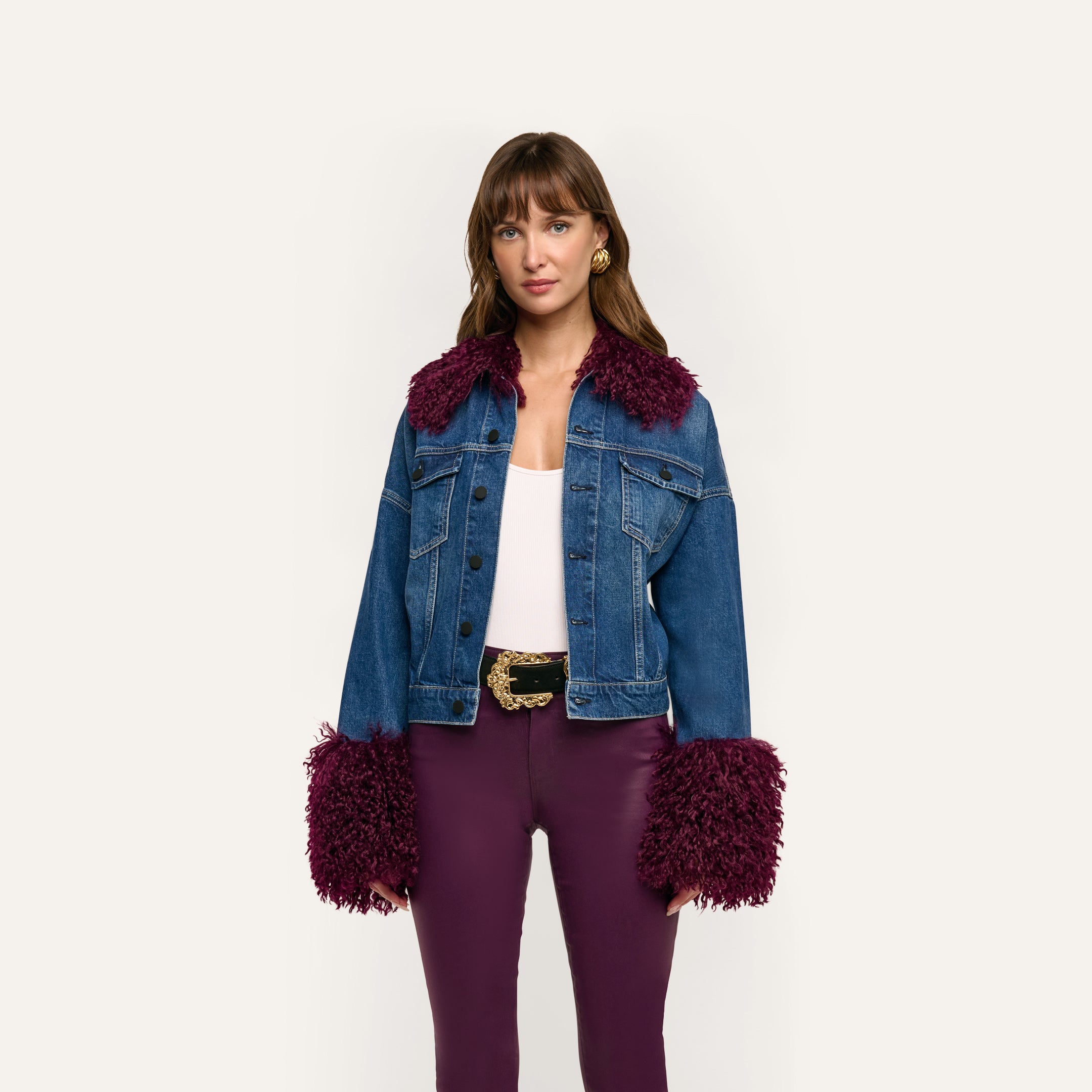 Bronson Jean Jacket in a cropped, medium-wash denim featuring a deep purple faux-fur collar and dramatic, long faux-fur trim cuffs.
