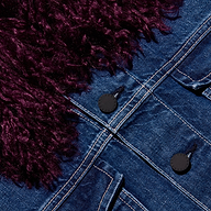 Close-up of a Bronson Jean Jacket, featuring a cropped blue denim design with a dark purple faux-fur collar and black buttons.