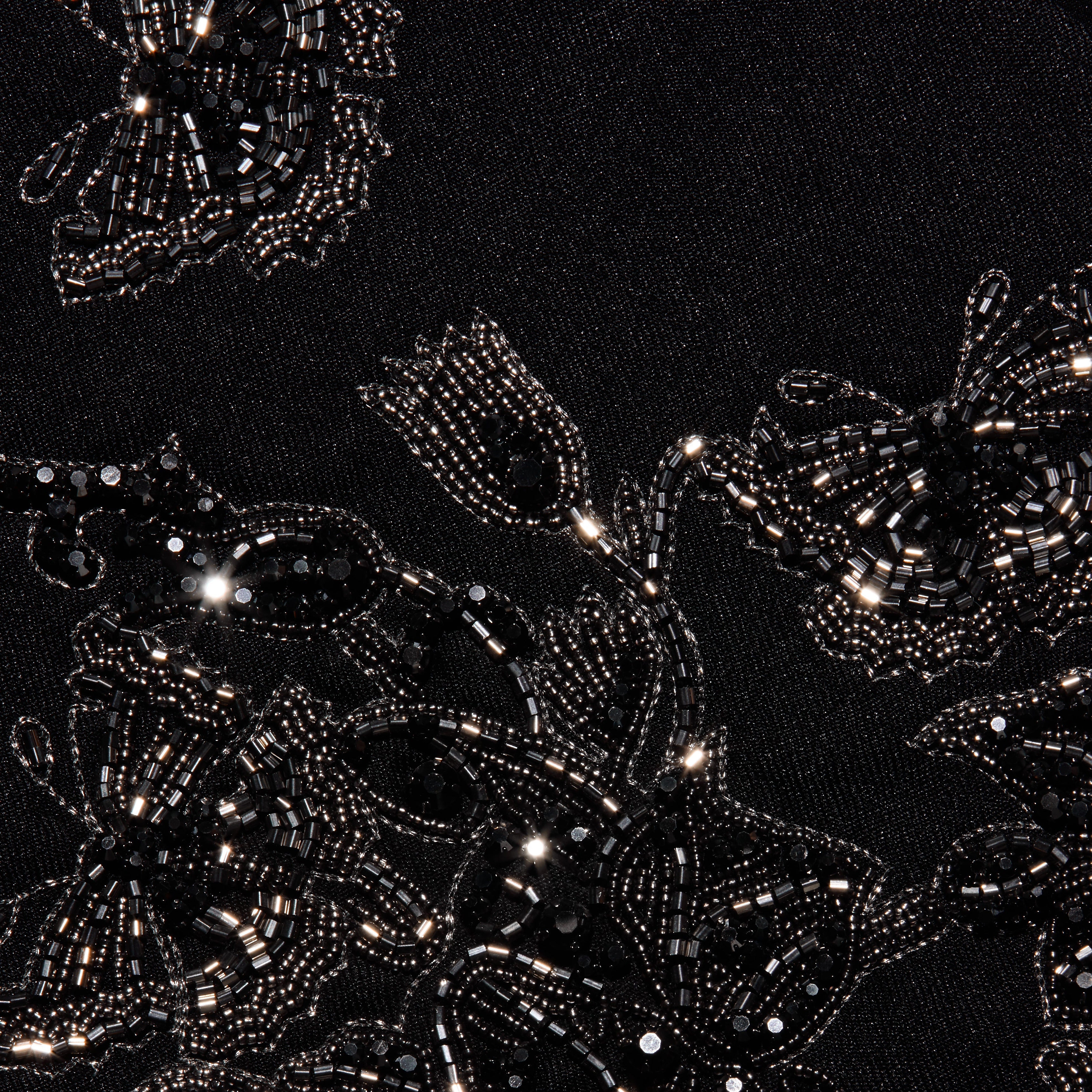 Clementine Embellished Blazer in black twill, detailed with intricate floral embroidery made of shiny black beads and sequins.