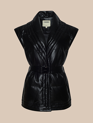 Ignis Puffer Vest: A sleeveless black vegan leather puffer vest featuring a wide, shawl collar-style quilted neckline, belted waist, and an inner collar tag marked LAGENCE. This chic transitional outerwear piece is showcased against a plain beige background.