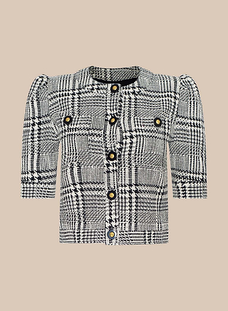 The Allegra Cropped Tweed Jacket features a black and white plaid pattern, short puff sleeves, and gold buttons, shown against a plain beige background.