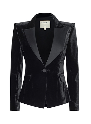 The Philippa Tux Blazer is a black velvet women’s blazer with satin lapels, front flap pockets, and a single button closure by LAGENCE. Featured at New York Fashion Week Fall 2026, it’s shown on a white background.