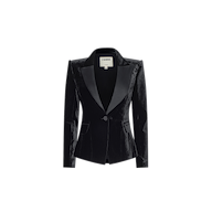The Philippa Velvet Blazer, crafted in black velvet with satin lapels, features a single front button closure and slightly padded shoulders, and is displayed on a plain white background.