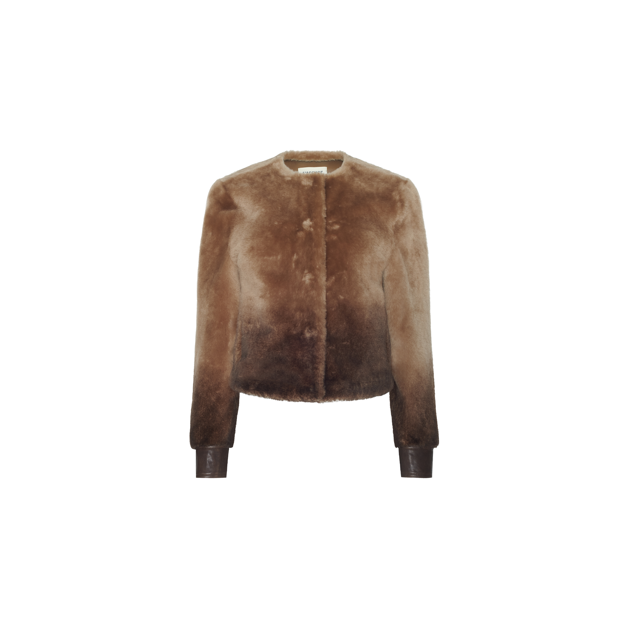 Voltaire Shearling Jacket in brown, featuring a cropped fit, an ombré effect fading from a light tan collarless neckline to a dark brown waist, and leather cuffs.