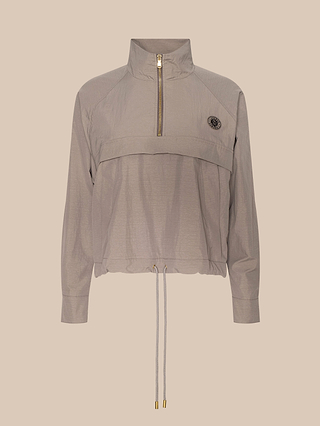 The Vex Cropped Windbreaker is a light gray long-sleeve activewear jacket with a half-zip front, high collar, adjustable drawstring hem, and a small round logo on the left chest. Displayed on a plain beige background, this stylish windbreaker features a water-repellent finish for everyday versatility.