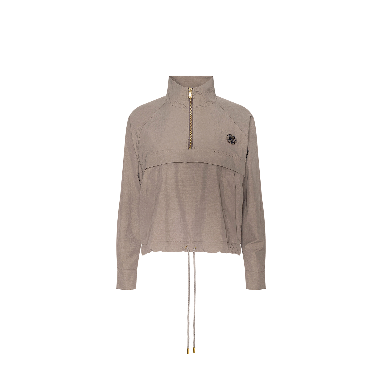 Vex Cropped Windbreaker in light brown, featuring long sleeves, a half-zip front, high collar, drawstring hem, and a small round emblem on the left chest, displayed on a plain white background.
