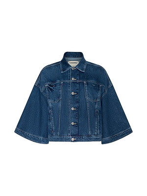 The Silas Cape Jacket is a blue, all-cotton denim shirt jacket with wide, cropped cape sleeves, front button closure, visible seams, a classic collar, and two pointed flap chest pockets. Inside label reads L’AGENCE.