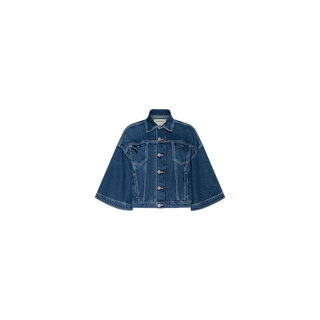 The Silas Cape Jacket, shown on a plain white background, is a blue denim piece crafted from 100 cotton, featuring cape sleeves, a button front closure, and two chest pockets.