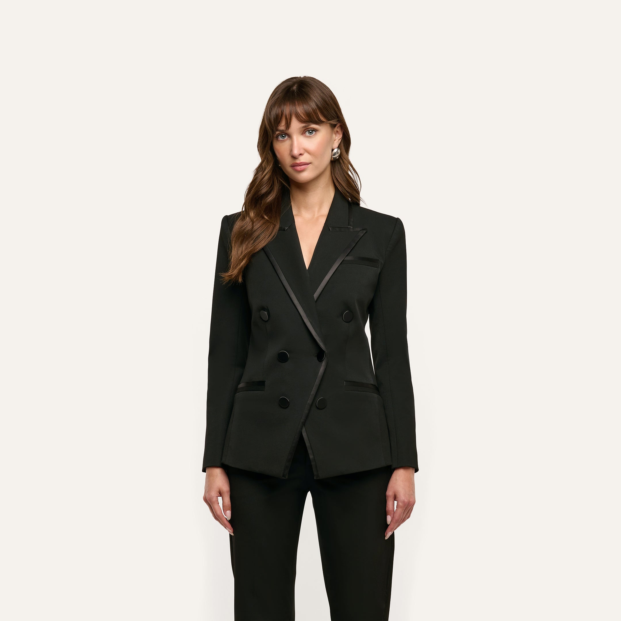 A tailored black Kyomi Double-Breasted Blazer featuring satin-trimmed lapels and pockets.