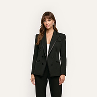 A woman wears a Kyomi Double-Breasted Blazer with satin-finish lapels over a white top.