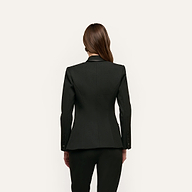 Back view of a person wearing a tailored black double-breasted Kyomi Double-Breasted Blazer in stretch suit fabric.