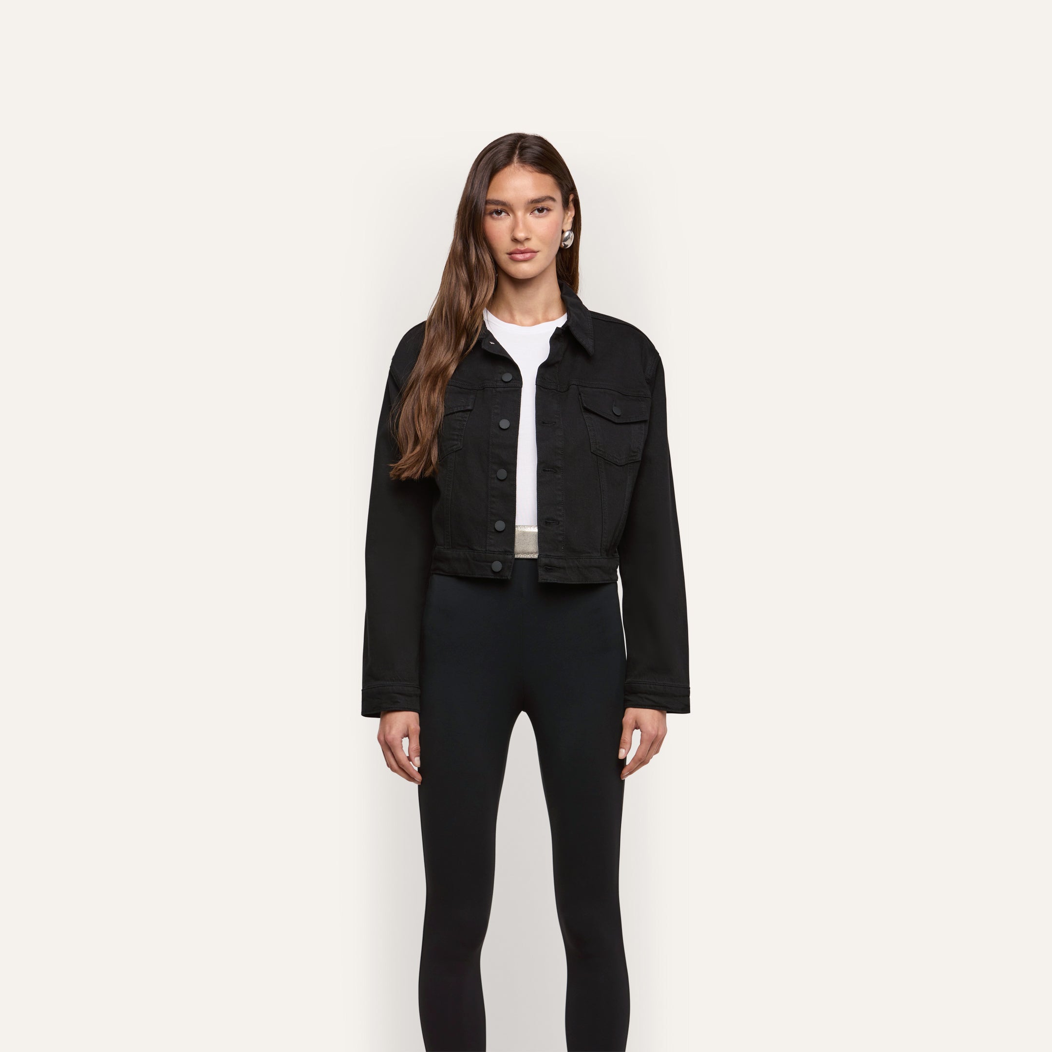 A black cropped Alessia Jean Jacket worn over a white t-shirt and black leggings.