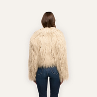 Back view of a person wearing a beige Fenella Faux Fur Coat and blue jeans.