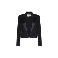 The Ismerie Cropped Blazer, a black long-sleeve double-breasted piece with satin lapels, is displayed on a plain white background, inspired by Paris Fashion Week elegance.
