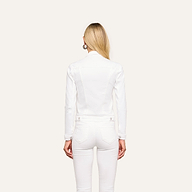 A person with long blonde hair is shown from the back, wearing the Celine Jean Jacket in optic white with matching white pants against a plain, light background.