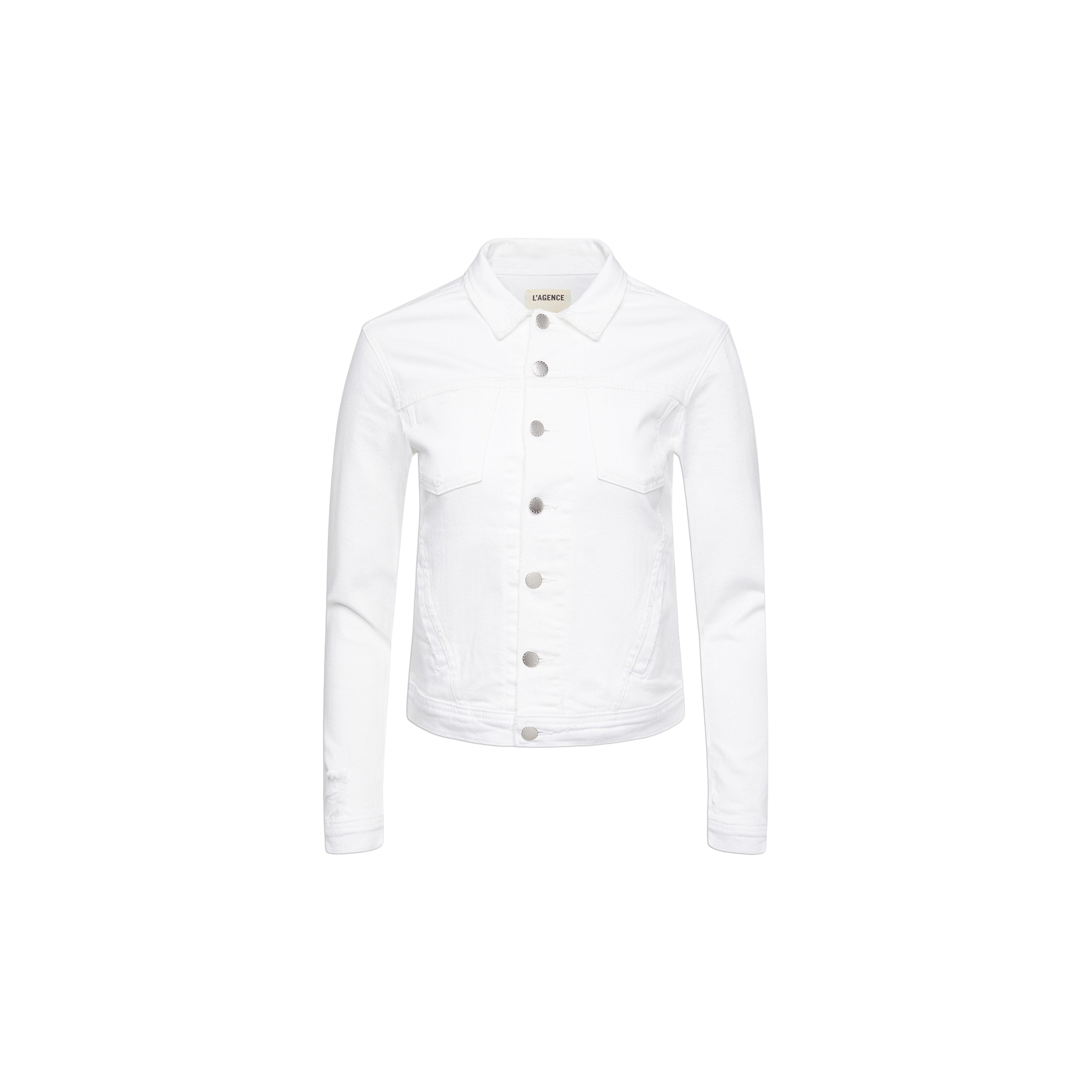 The Celine Jean Jacket is an optic white denim jacket featuring silver buttons, a pointed collar, and long sleeves, designed in a relaxed fit and shown on a white background.