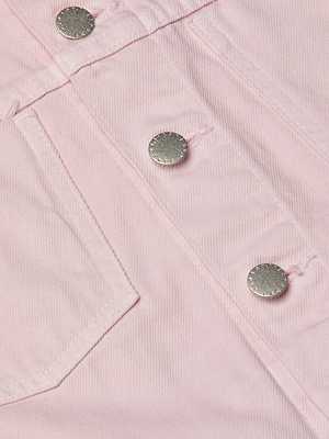 Close-up of a pastel lilac all-cotton denim fabric with silver metal buttons and a visible seam outlining a pocket, highlighting the texture and stitching details that evoke the signature style of the Celine Jean Jacket.