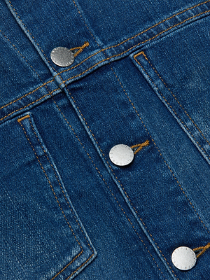 Close-up of the Celine Jean Jacket shows blue denim fabric with two pockets, three silver buttons, and yellow stitching that highlights the texture, slim fit, and vintage wash finish.