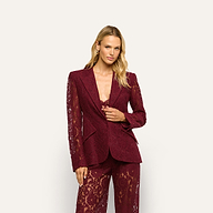 A model wears a Chamberlain Lace Blazer and matching pants in deep port red lace.