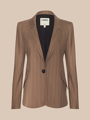 The Chamberlain Blazer features a tan pinstripe design, single black button closure, notched lapels, and front pockets in lightweight suit fabric. Shown on a light beige background with an inner LAGENCE label.