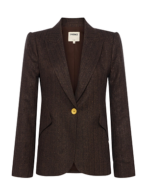 The Chamberlain Pinstriped Blazer by L'AGENCE is a brown, tailored jacket in recycled wool-blend, featuring a single gold button, notched lapels, two slanted front pockets, structured fit, and subtle pinstripes.