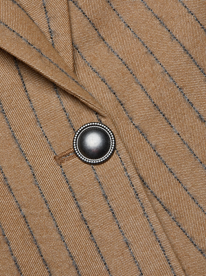 Close-up of the Chamberlain Blazer by L'AGENCE in beige and gray pinstripes, featuring a metallic button with a decorative beaded edge.