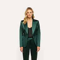 A person wearing a forest green Chamberlain Satin Blazer over a black top and matching trousers.
