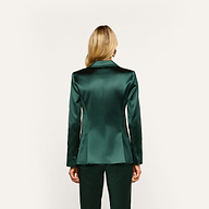 Back view of a person wearing a forest green Chamberlain Satin Blazer and matching trousers.